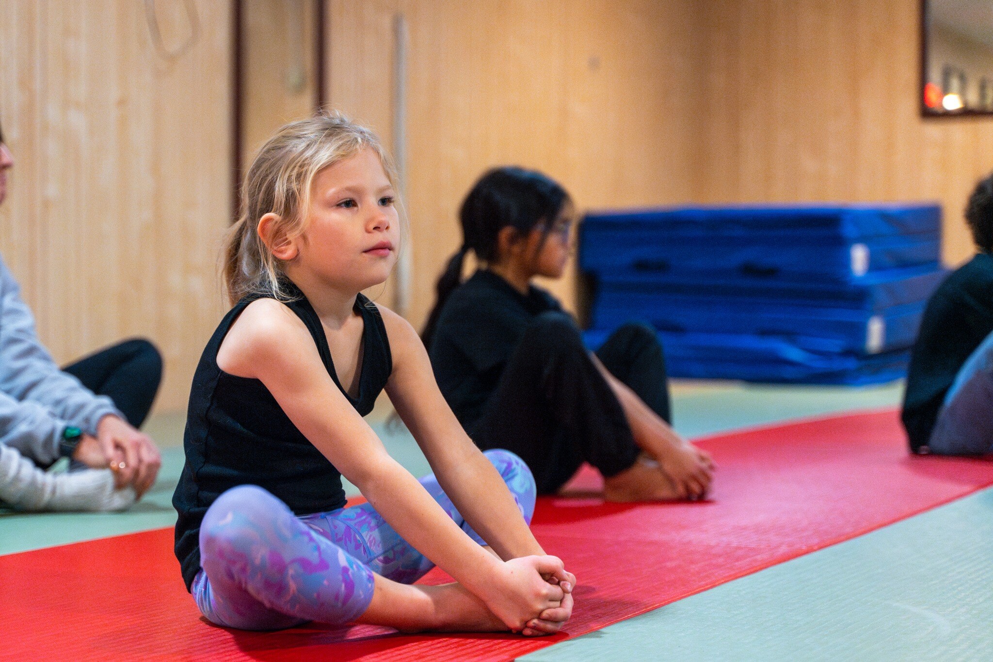 Young students stretching in class